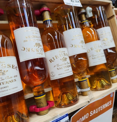 Sauternes Wine bottles display for sell in the supermarket shelves